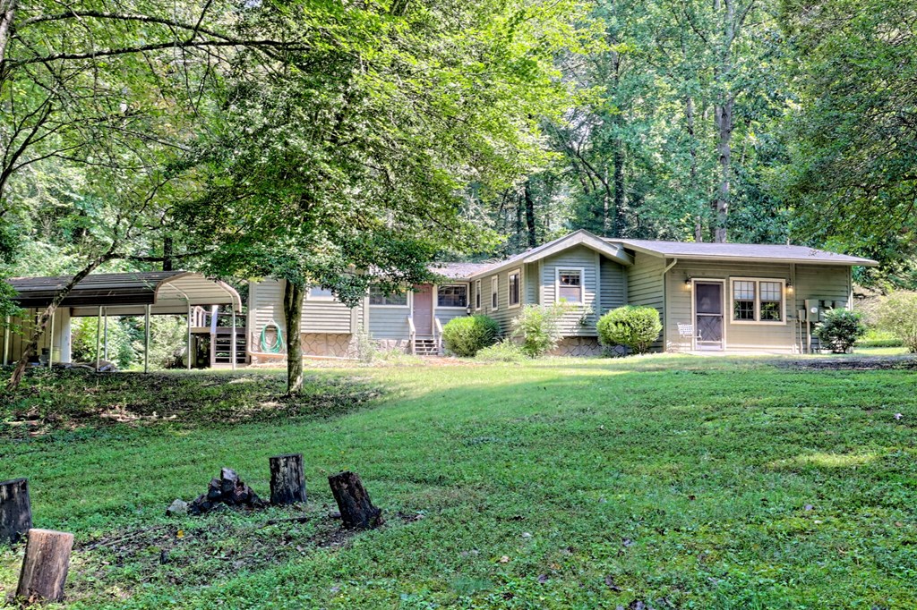 641 Cold Branch Road Hayesville, NC 28904 - Photo 62 of 65 a view of a house with a yard and a tree