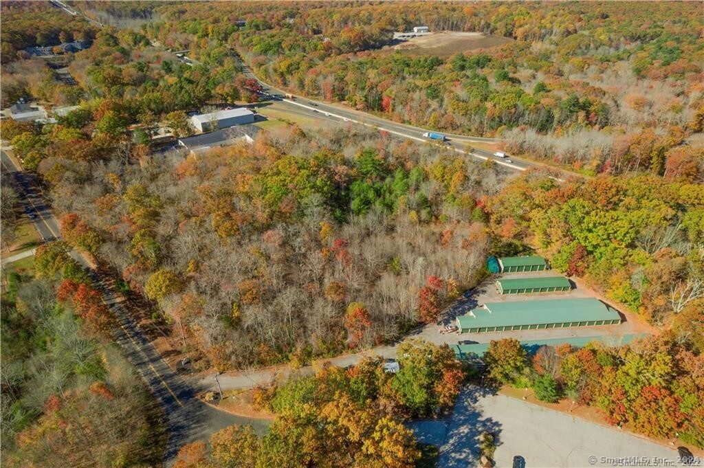 14 Colton Road East Lyme, CT 06357 - Photo 3 of 8 a view of a yard with trees