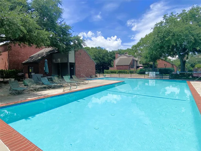 a view of a backyard with a patio
