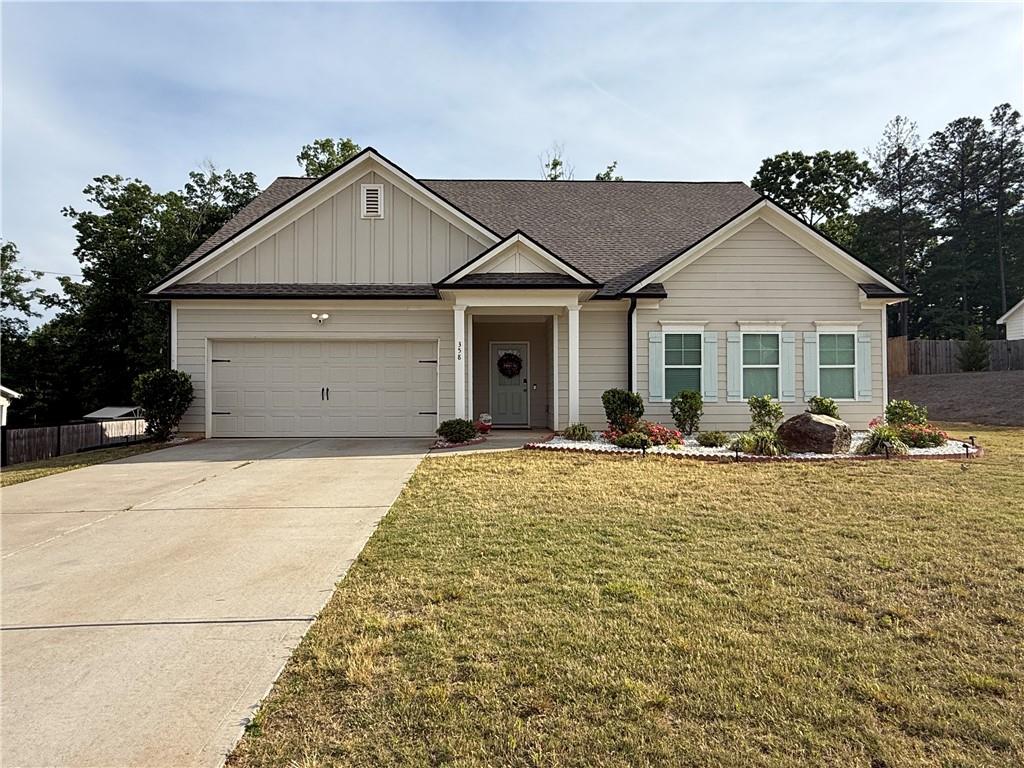 358 Mulberry Road Winder, GA 30680 - Photo 19 of 21 a view of a house with small yard and plants