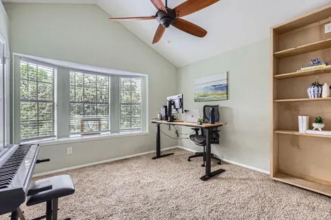 a view of a workspace with furniture