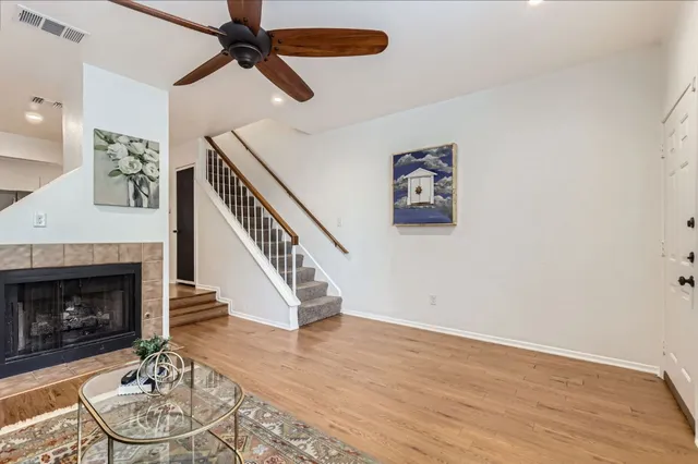 a living room with furniture and a fireplace
