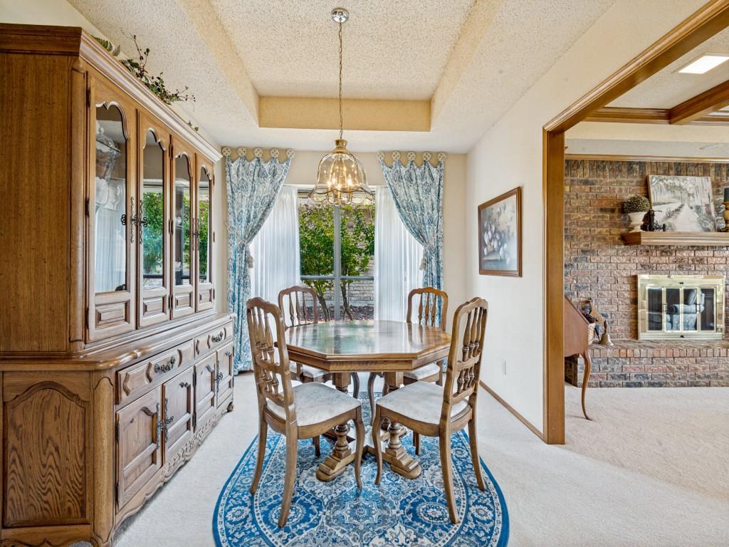 2213 Ridgewood Bedford, TX 76021 - Photo 9 of 40 This dining space features a bay window that opens to colorful landscaping.