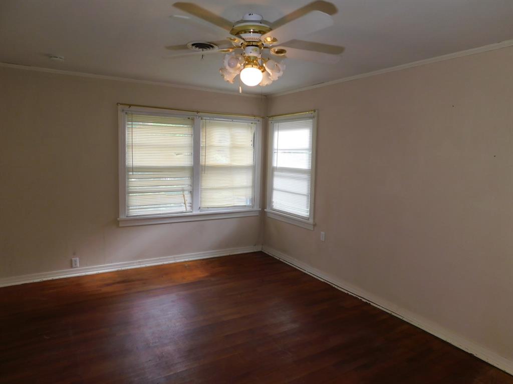 24044 Highway 157 Springhill, LA 71075 - Photo 33 of 40 an empty room with wooden floor and windows