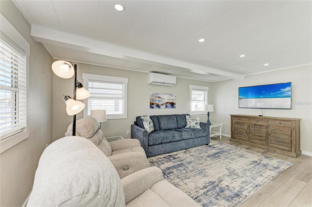 10315 Cortez Road West, Unit 61 Bradenton, FL 34210 - Photo 19 of 46 a living room with furniture and a flat screen tv