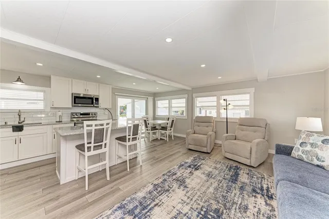 a view of a bathroom with a sink and a mirror
