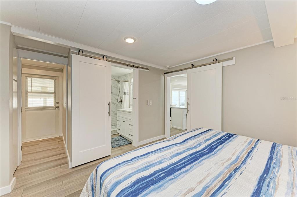 10315 Cortez Road West, Unit 61 Bradenton, FL 34210 - Photo 23 of 46 a view of a bedroom with wooden floor and closet