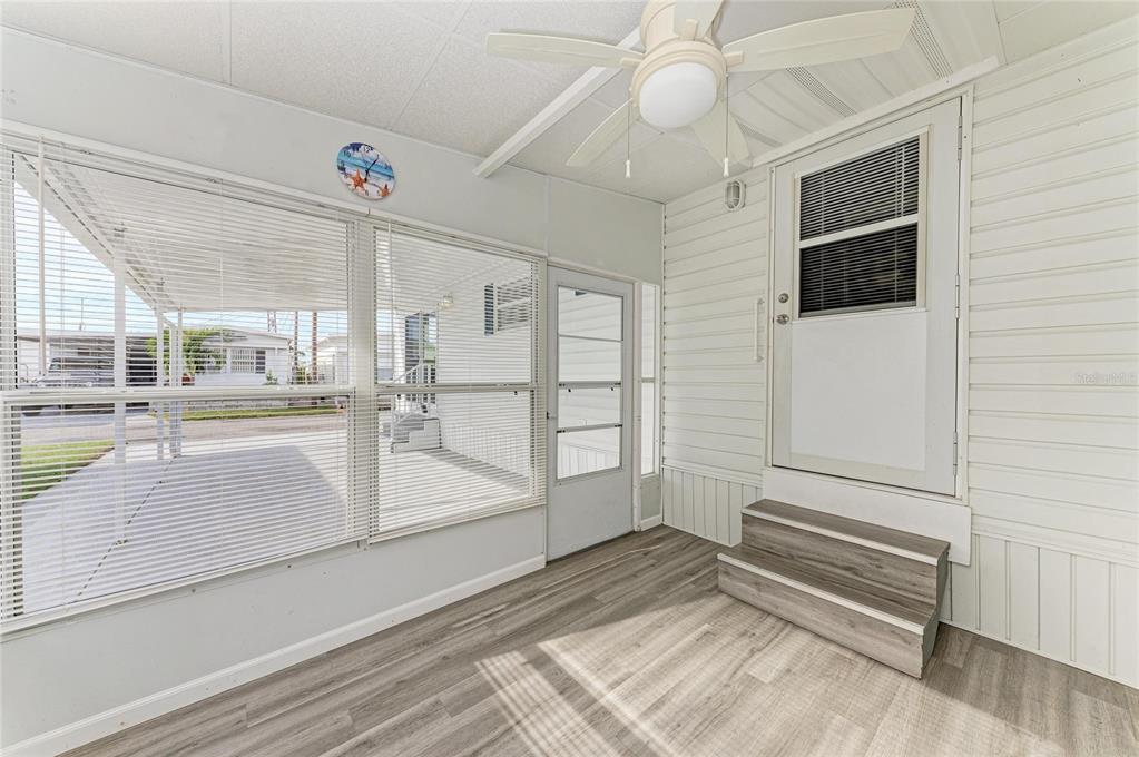 10315 Cortez Road West, Unit 61 Bradenton, FL 34210 - Photo 29 of 46 en empty room with wooden floor and windows