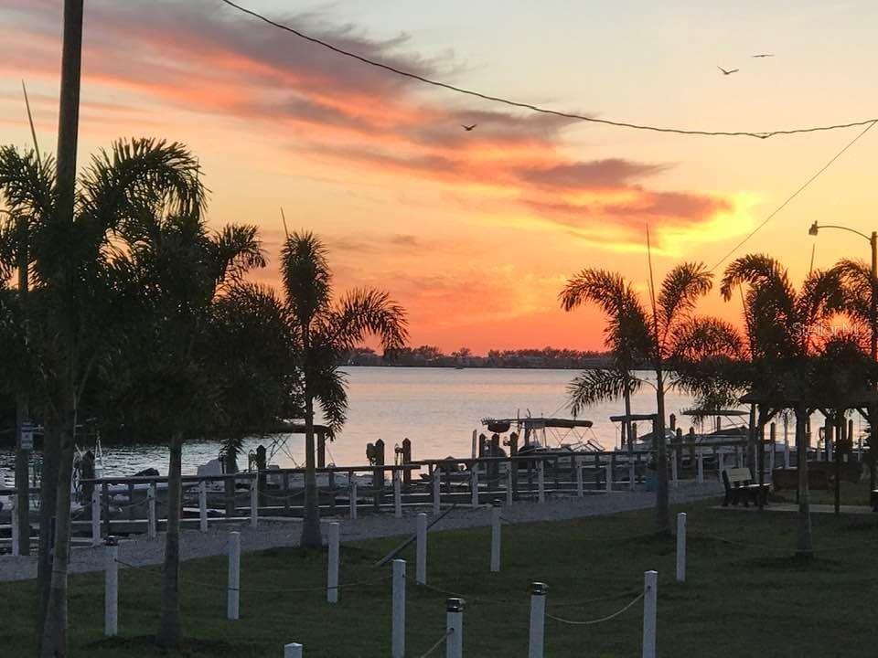 10315 Cortez Road West, Unit 61 Bradenton, FL 34210 - Photo 35 of 46 a view of ocean with boats and trees in the background