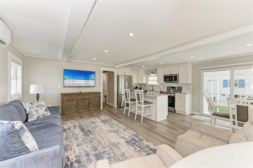 10315 Cortez Road West, Unit 61 Bradenton, FL 34210 - Photo 4 of 46 a living room with furniture and kitchen view