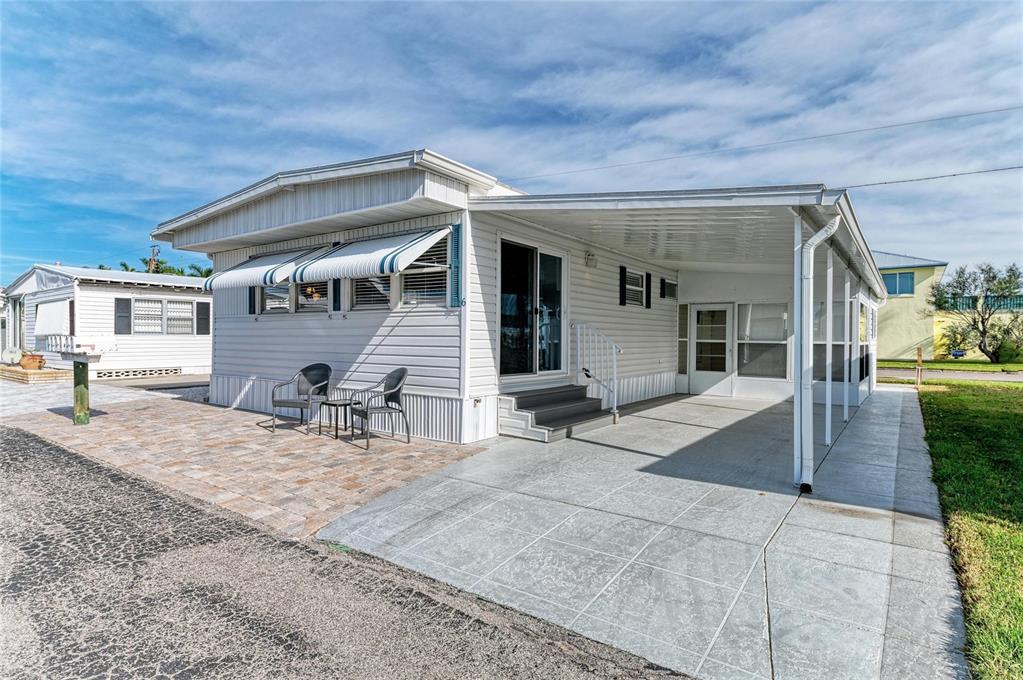 10315 Cortez Road West, Unit 61 Bradenton, FL 34210 - Photo 9 of 46 front view of a house with a patio