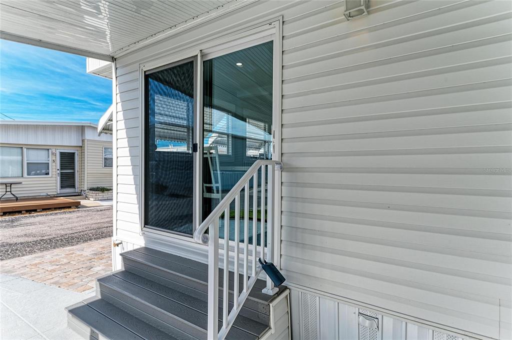 10315 Cortez Road West, Unit 61 Bradenton, FL 34210 - Photo 10 of 46 a view of staircase with railing and white walls