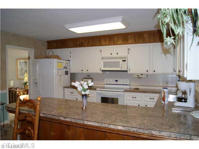 3515 Court Road Winston-Salem, NC 27106 - Photo 6 of 16 Kitchen. Nice bar area separates the kitchen and eating area