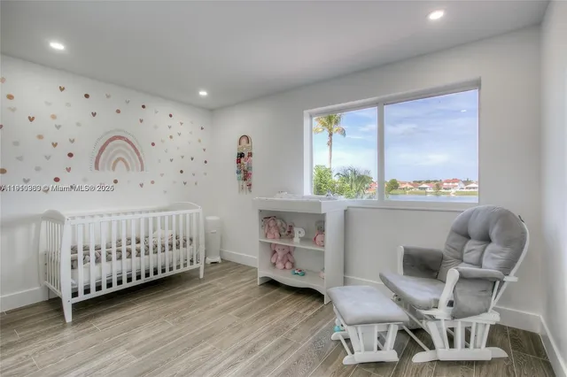 a bedroom with furniture and a window