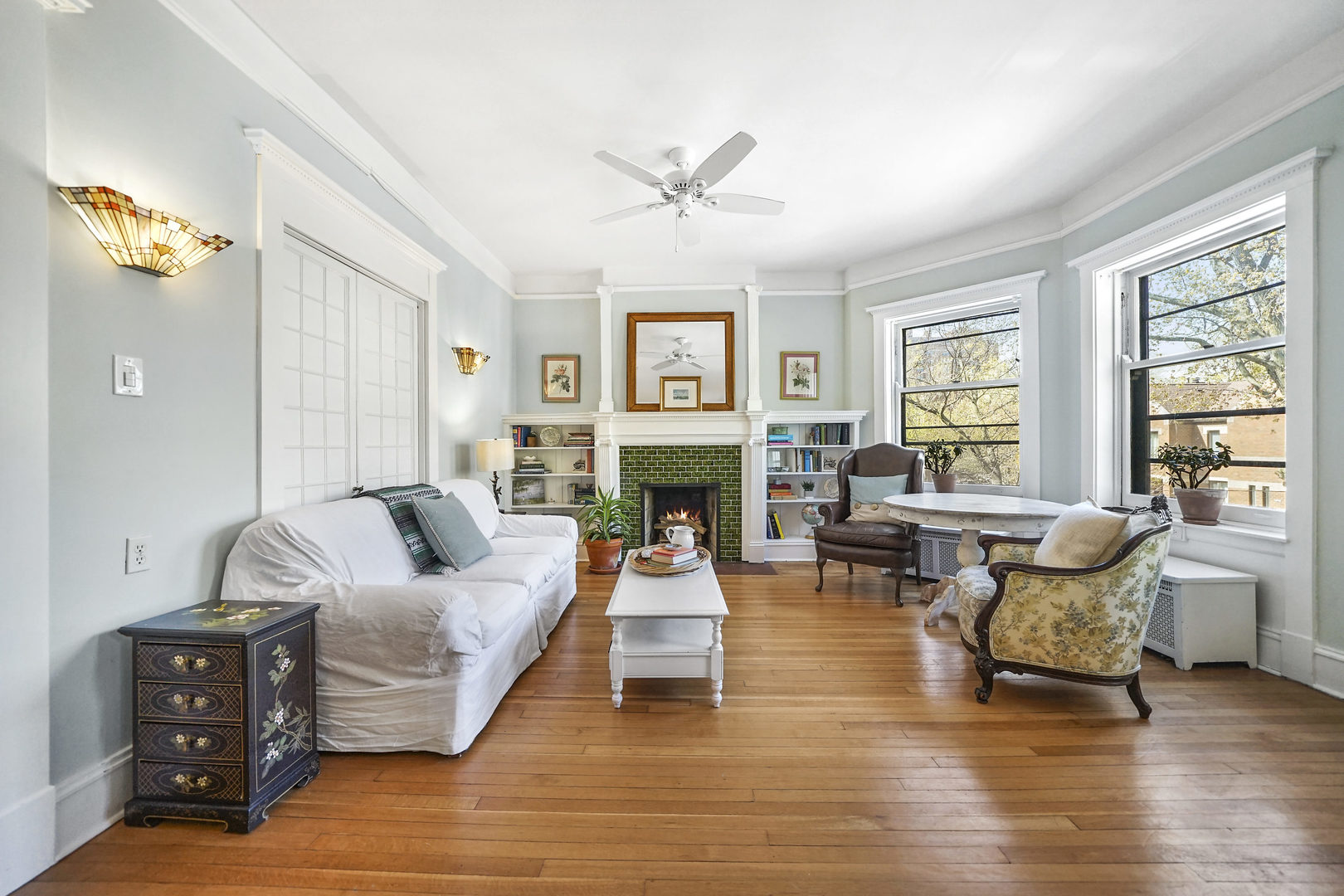 5707 South Blackstone Avenue, Unit 2 Chicago, IL 60637 - Photo 2 of 25 a living room with fireplace furniture and a wooden floor