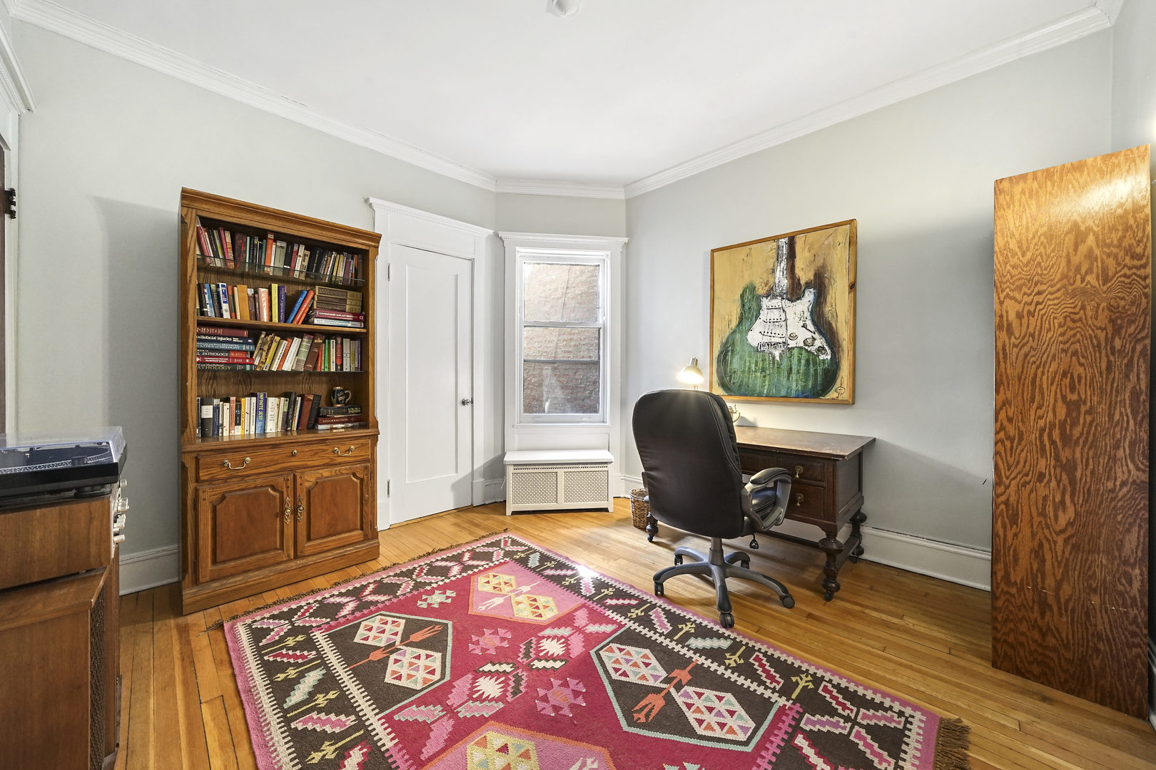 5707 South Blackstone Avenue, Unit 2 Chicago, IL 60637 - Photo 16 of 25 a workspace with furniture and wooden floor