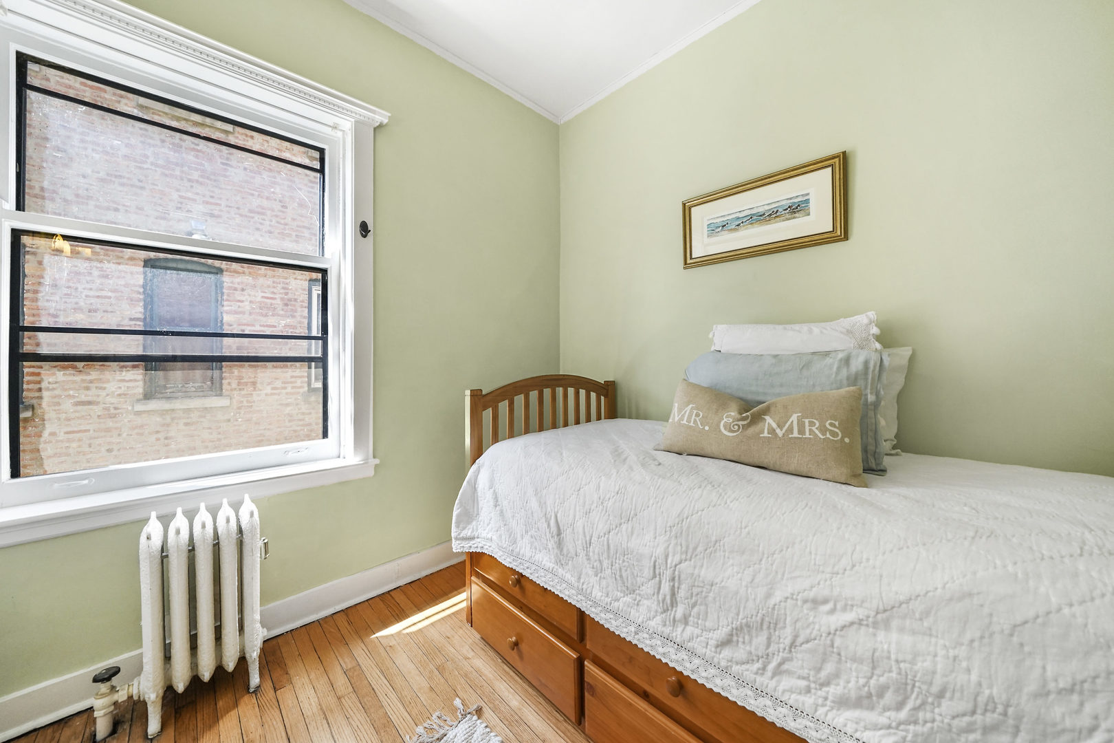 5707 South Blackstone Avenue, Unit 2 Chicago, IL 60637 - Photo 21 of 25 a bedroom with a bed and a window