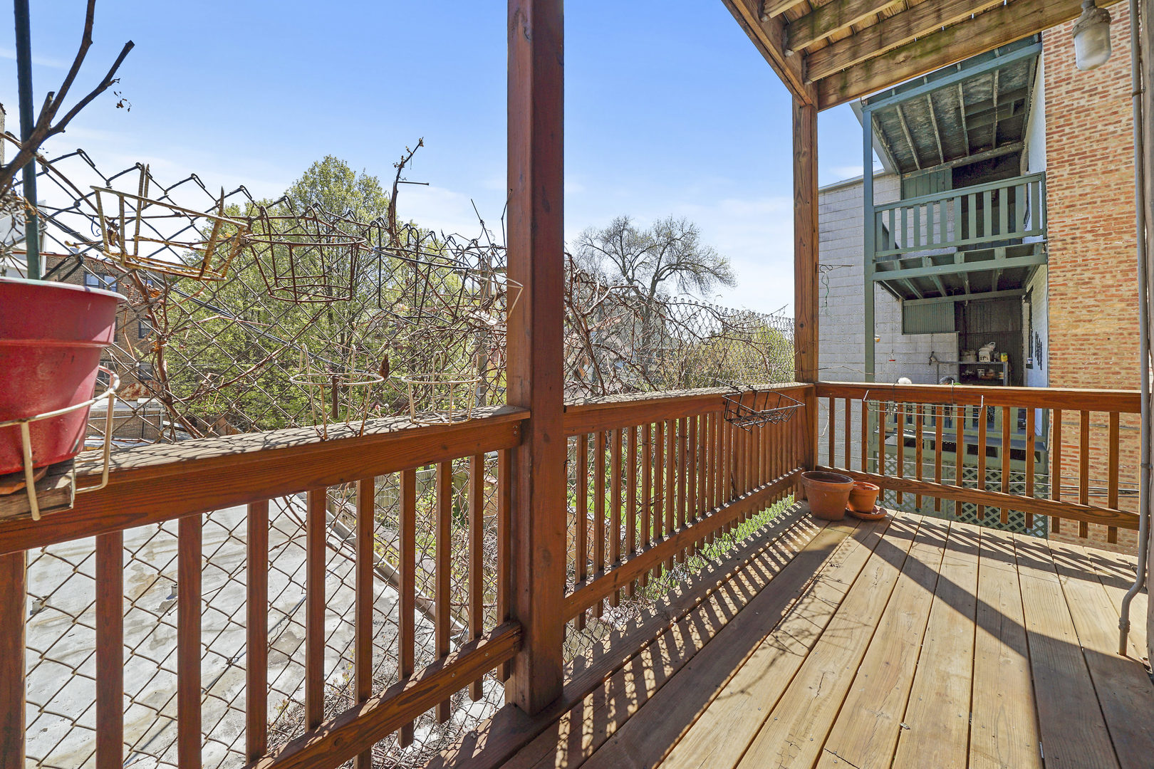 5707 South Blackstone Avenue, Unit 2 Chicago, IL 60637 - Photo 23 of 25 a view of a balcony with wooden floor