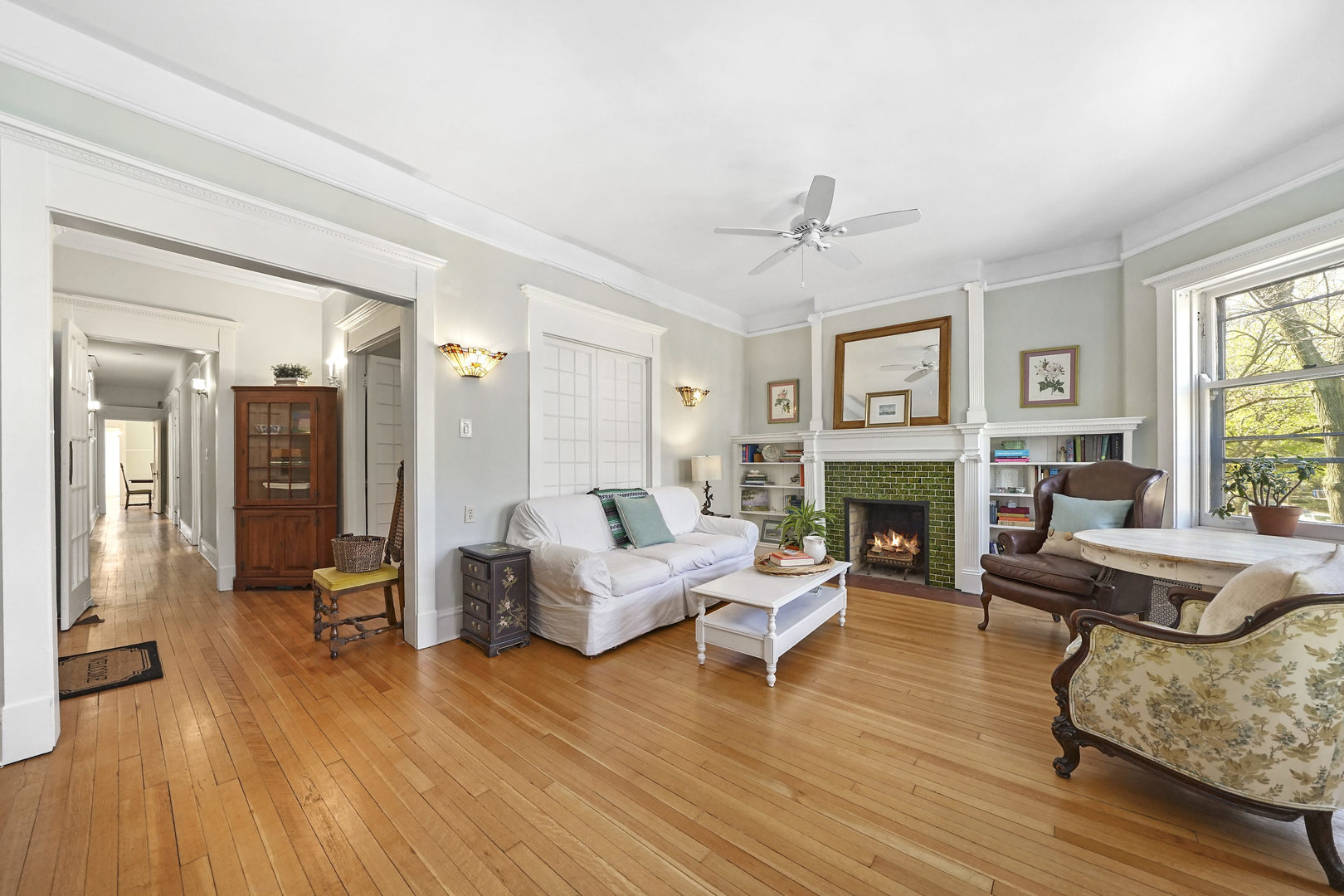 5707 South Blackstone Avenue, Unit 2 Chicago, IL 60637 - Photo 4 of 25 a living room with furniture and a fireplace