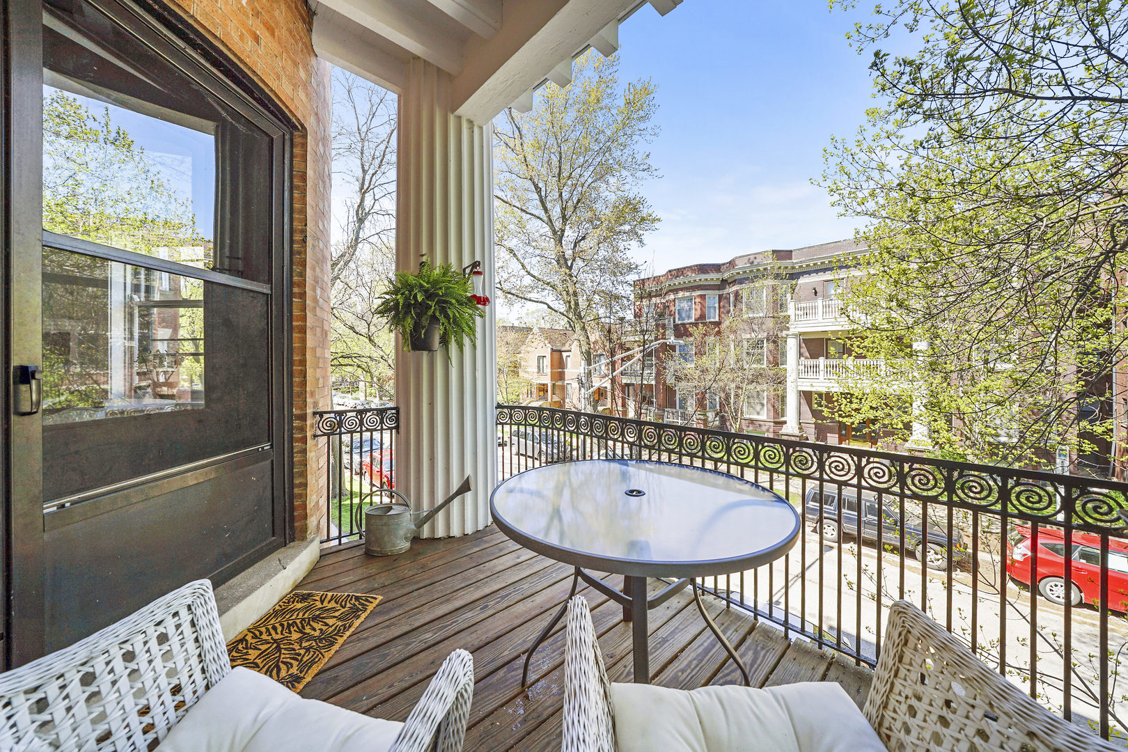 5707 South Blackstone Avenue, Unit 2 Chicago, IL 60637 - Photo 5 of 25 a view of a balcony with a table and chairs