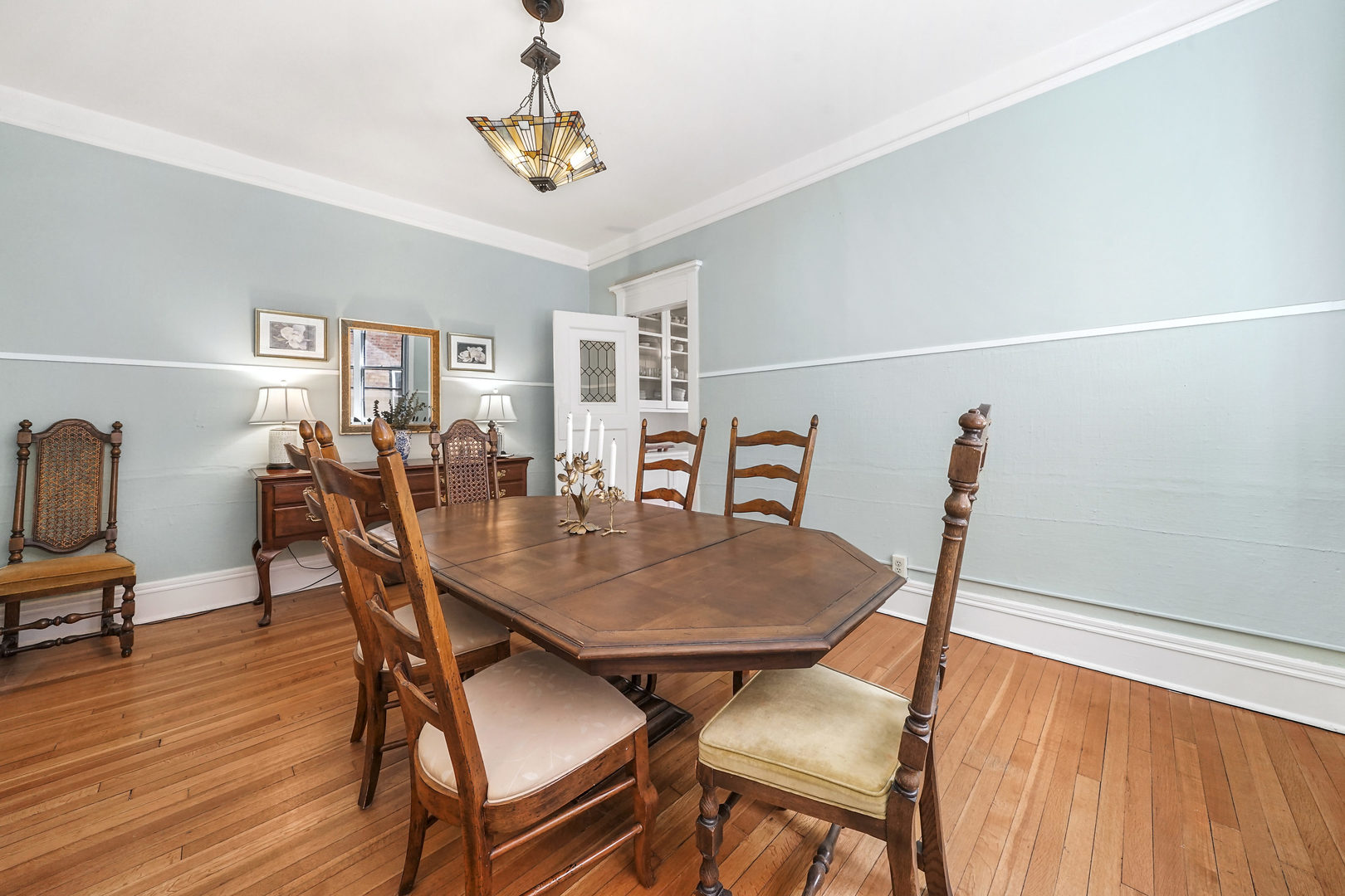 5707 South Blackstone Avenue, Unit 2 Chicago, IL 60637 - Photo 6 of 25 a view of a dining room with furniture and wooden floor
