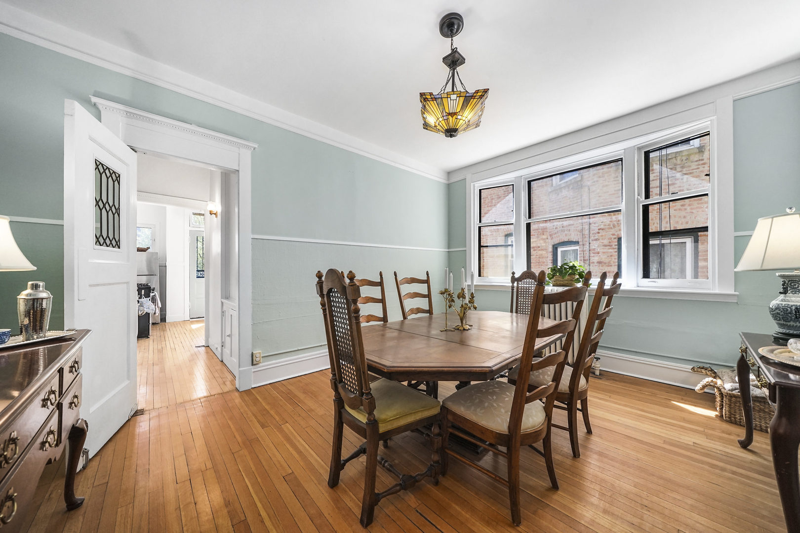 5707 South Blackstone Avenue, Unit 2 Chicago, IL 60637 - Photo 7 of 25 a view of a dining room with furniture and wooden floor