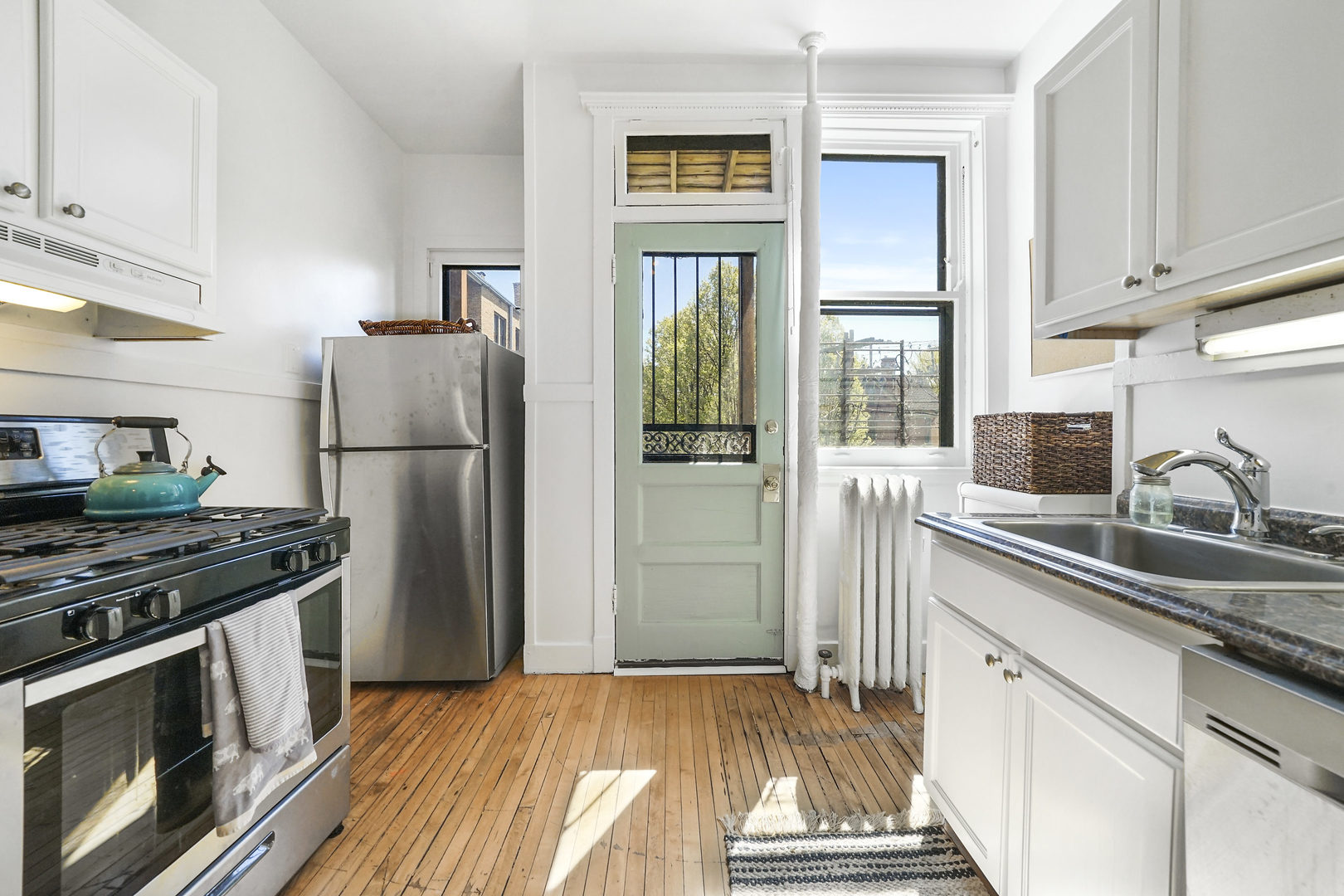 5707 South Blackstone Avenue, Unit 2 Chicago, IL 60637 - Photo 8 of 25 a kitchen with a refrigerator and a sink