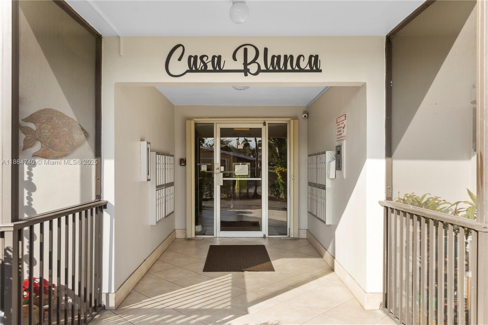 701 Northeast 1st Court, Unit 209 Hallandale Beach, FL 33009 - Photo 2 of 39 a view of a entrance door of the house