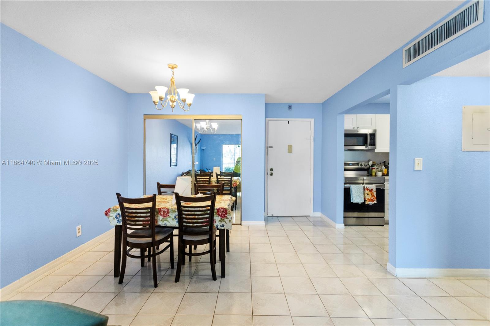 701 Northeast 1st Court, Unit 209 Hallandale Beach, FL 33009 - Photo 24 of 39 a view of a dining room with furniture