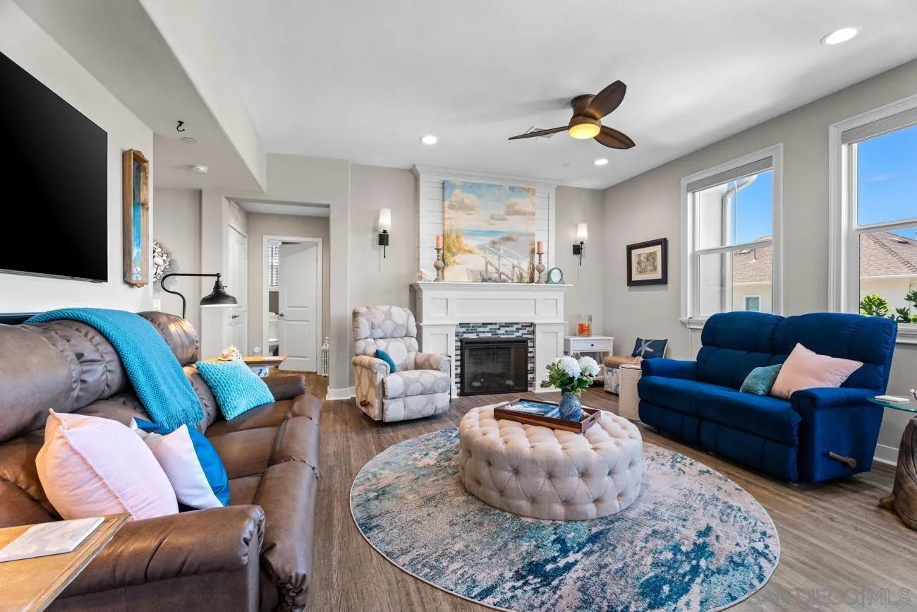 4326 Star Path Way, Unit 1 Oceanside, CA 92056 - Photo 11 of 46 a living room with furniture and a fireplace