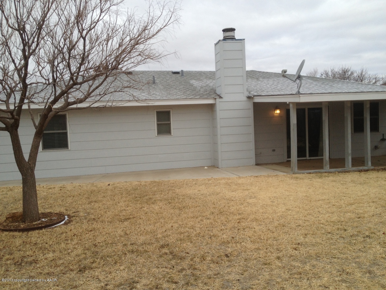 8213 Goodnight Trail Amarillo, TX 79110 - Photo 18 of 20 a front view of a house with a yard
