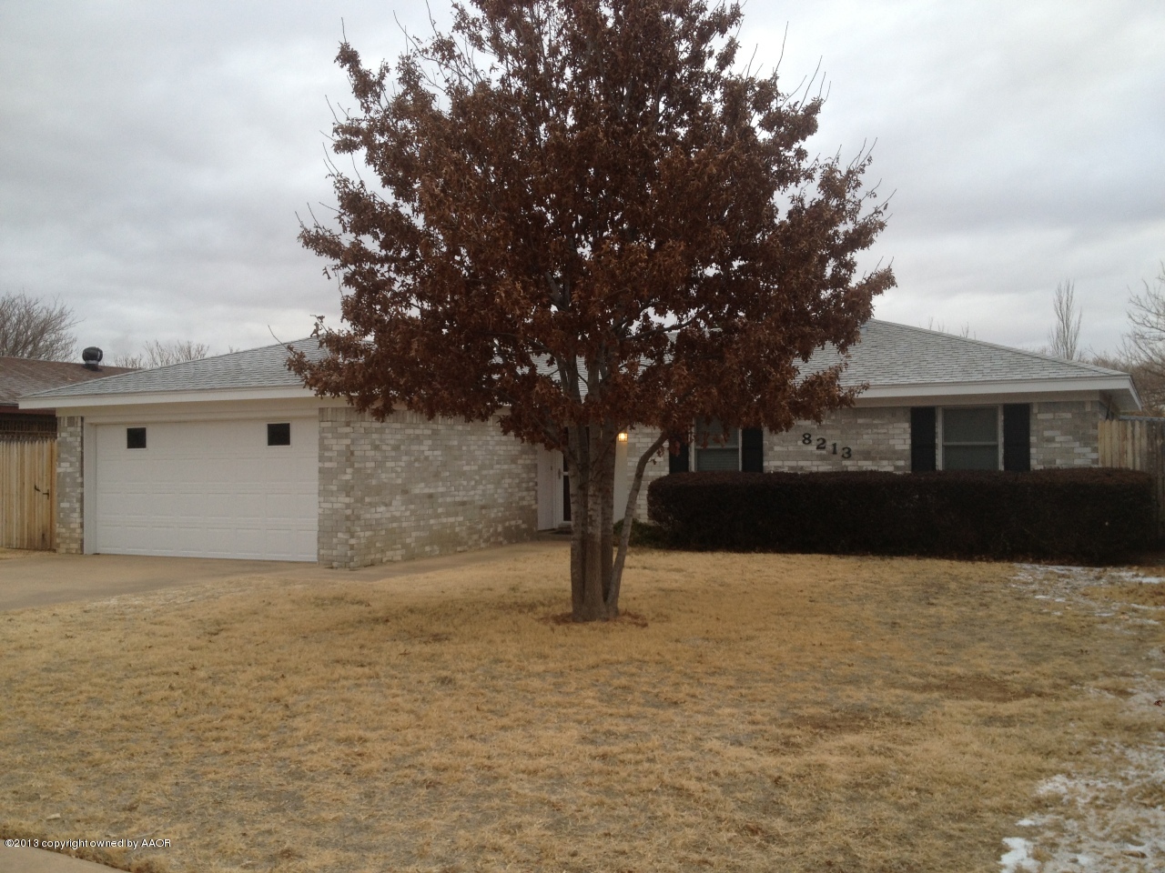 8213 Goodnight Trail Amarillo, TX 79110 - Photo 2 of 20 a front view of a house with a yard