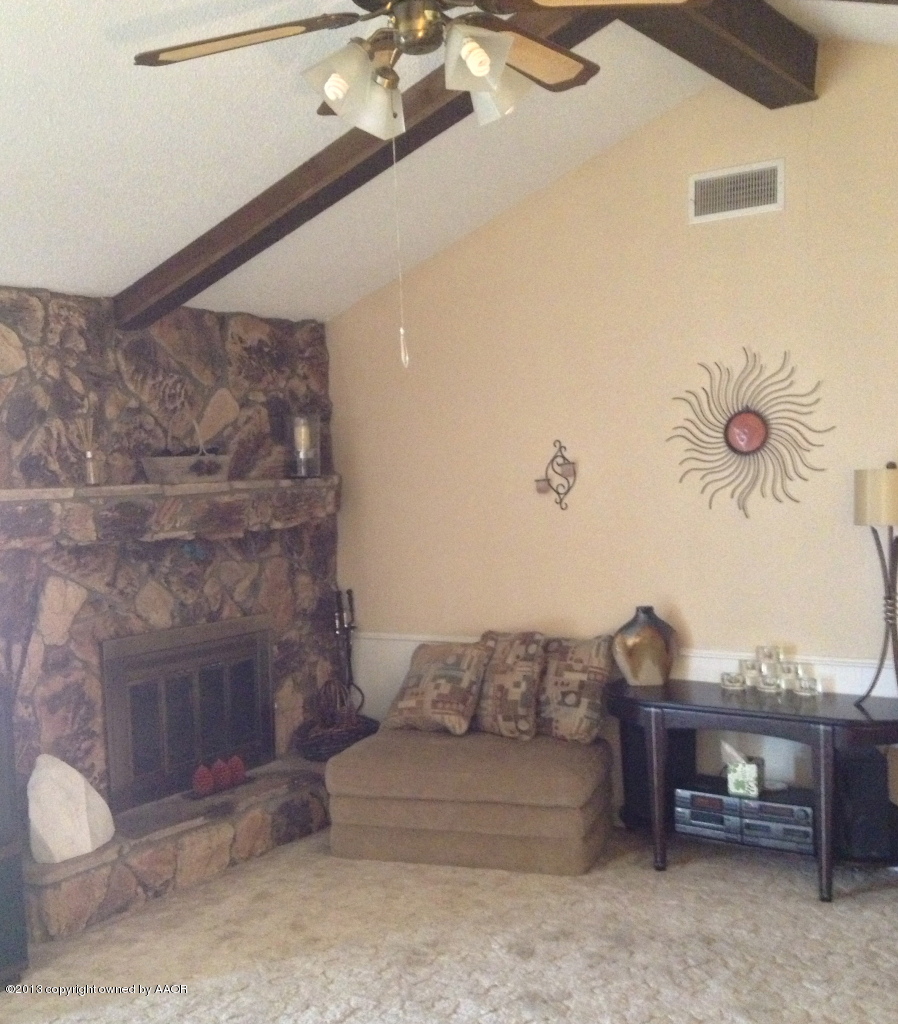 8213 Goodnight Trail Amarillo, TX 79110 - Photo 5 of 20 a living room with furniture and a fireplace