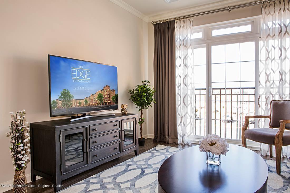 249 Broad Street, Unit 322 Matawan, NJ 07747 - Photo 23 of 27 a living room with furniture and large windows