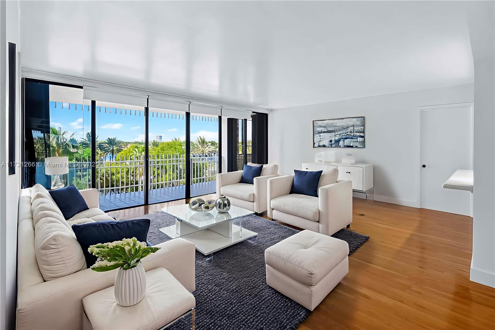 2 Grove Isle Drive, Unit B404 Coconut Grove, FL 33133 - Photo 2 of 36 a living room with furniture and a large window