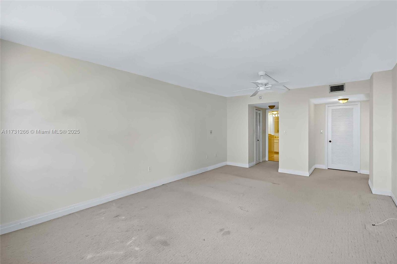 2 Grove Isle Drive, Unit B404 Coconut Grove, FL 33133 - Photo 24 of 36 an empty room with an entryway and yard
