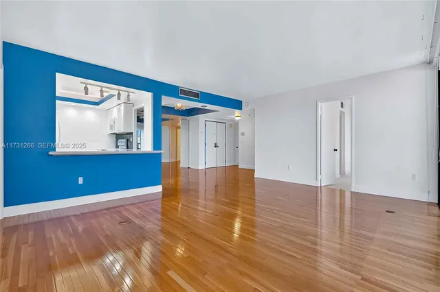 a view of an entryway with wooden floor