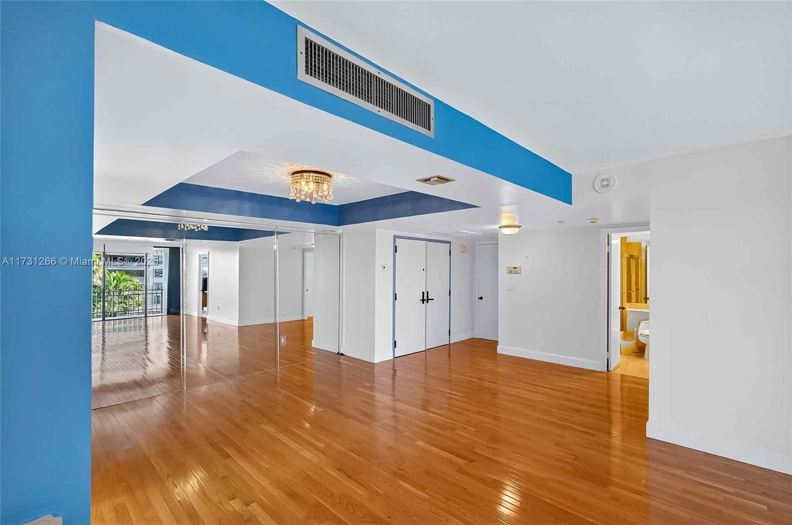 2 Grove Isle Drive, Unit B404 Coconut Grove, FL 33133 - Photo 9 of 36 a view of an entryway with wooden floor