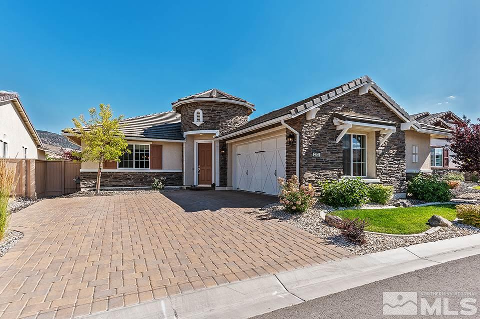 2220 Trakehner Lane Reno, NV 89521 - Photo 1 of 25 a front view of a house with yard and parking