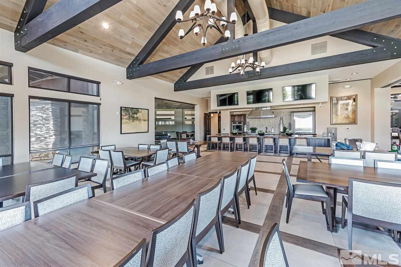 2220 Trakehner Lane Reno, NV 89521 - Photo 20 of 25 a dining room with lots of wooden furniture and a chandelier