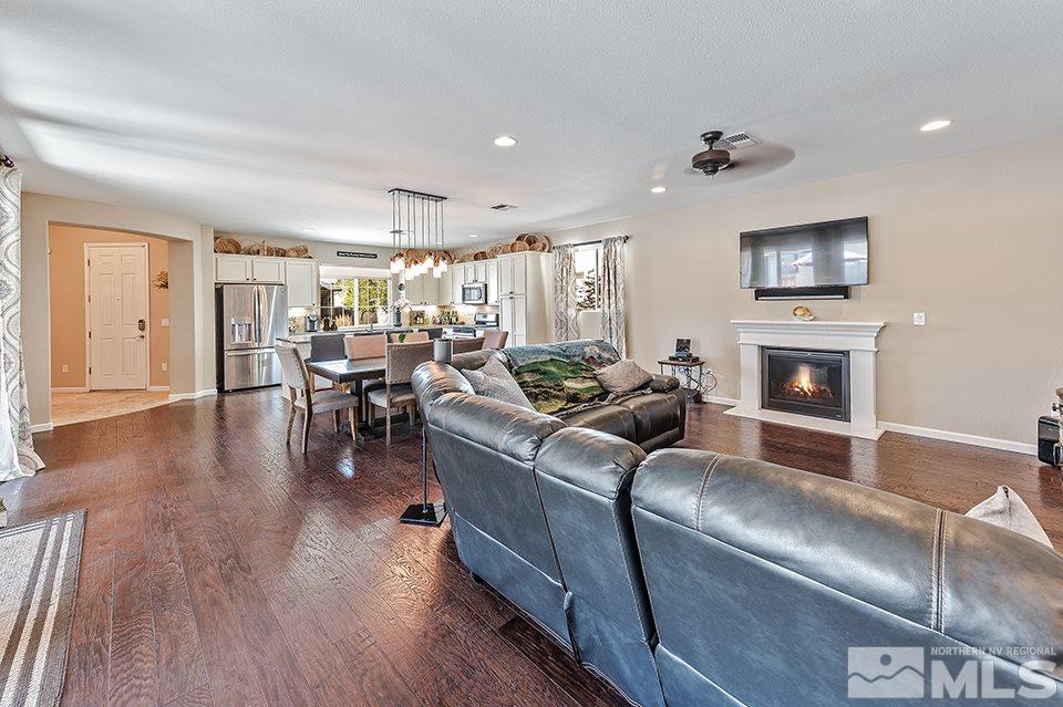 2220 Trakehner Lane Reno, NV 89521 - Photo 7 of 25 a living room with furniture fireplace and flat screen tv
