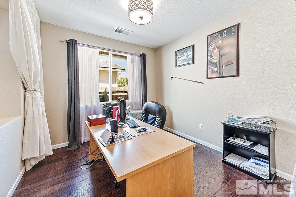 2220 Trakehner Lane Reno, NV 89521 - Photo 8 of 25 a workspace with furniture and wooden floor