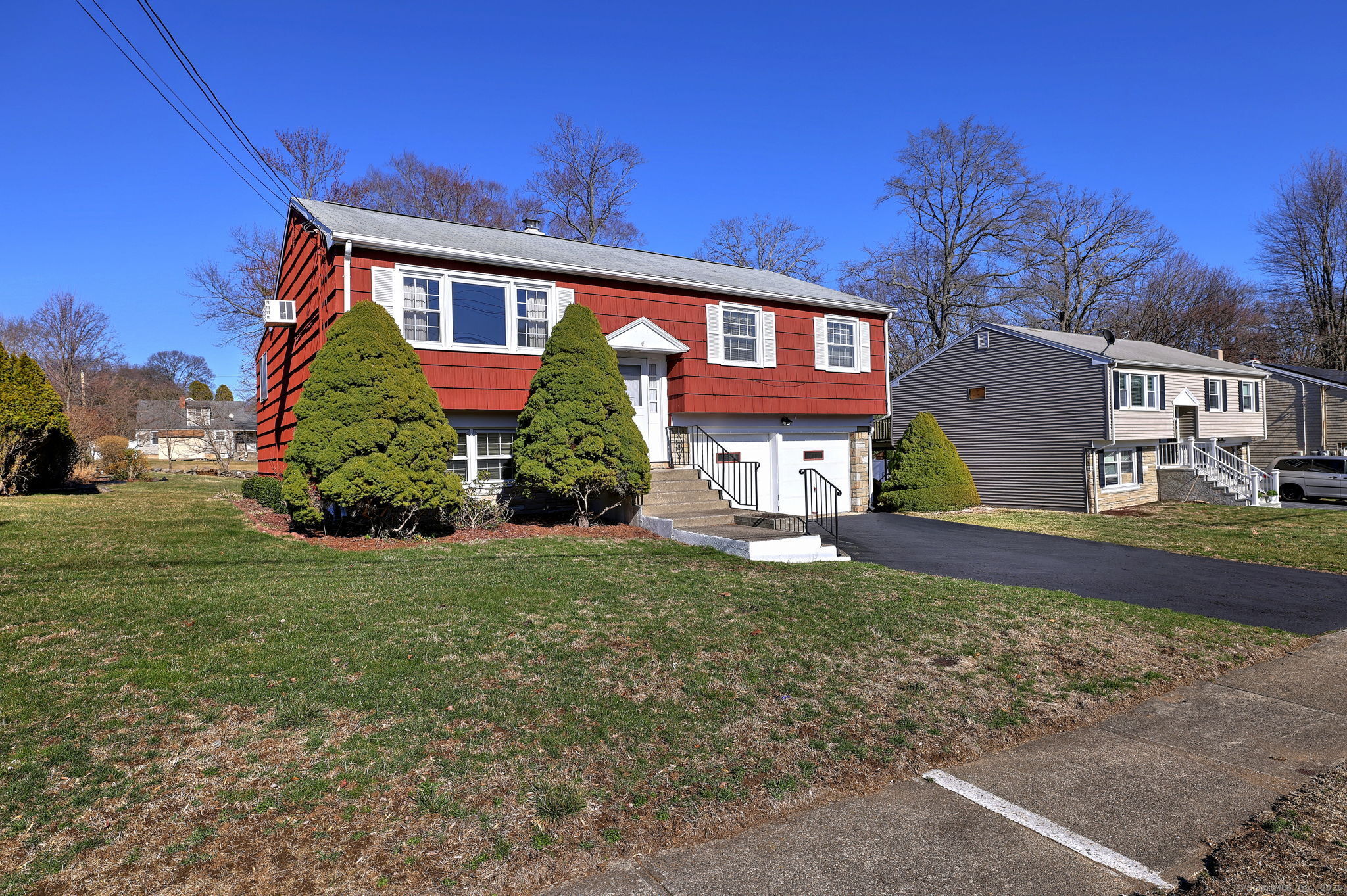 296 Sigwin Drive Fairfield, CT 06824 - Photo 1 of 1 a front view of a house with garden