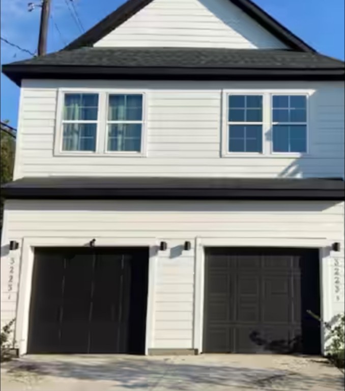 3223 Real Street, Unit B Houston, TX 77087 - Photo 1 of 6 a front view of a house with large windows