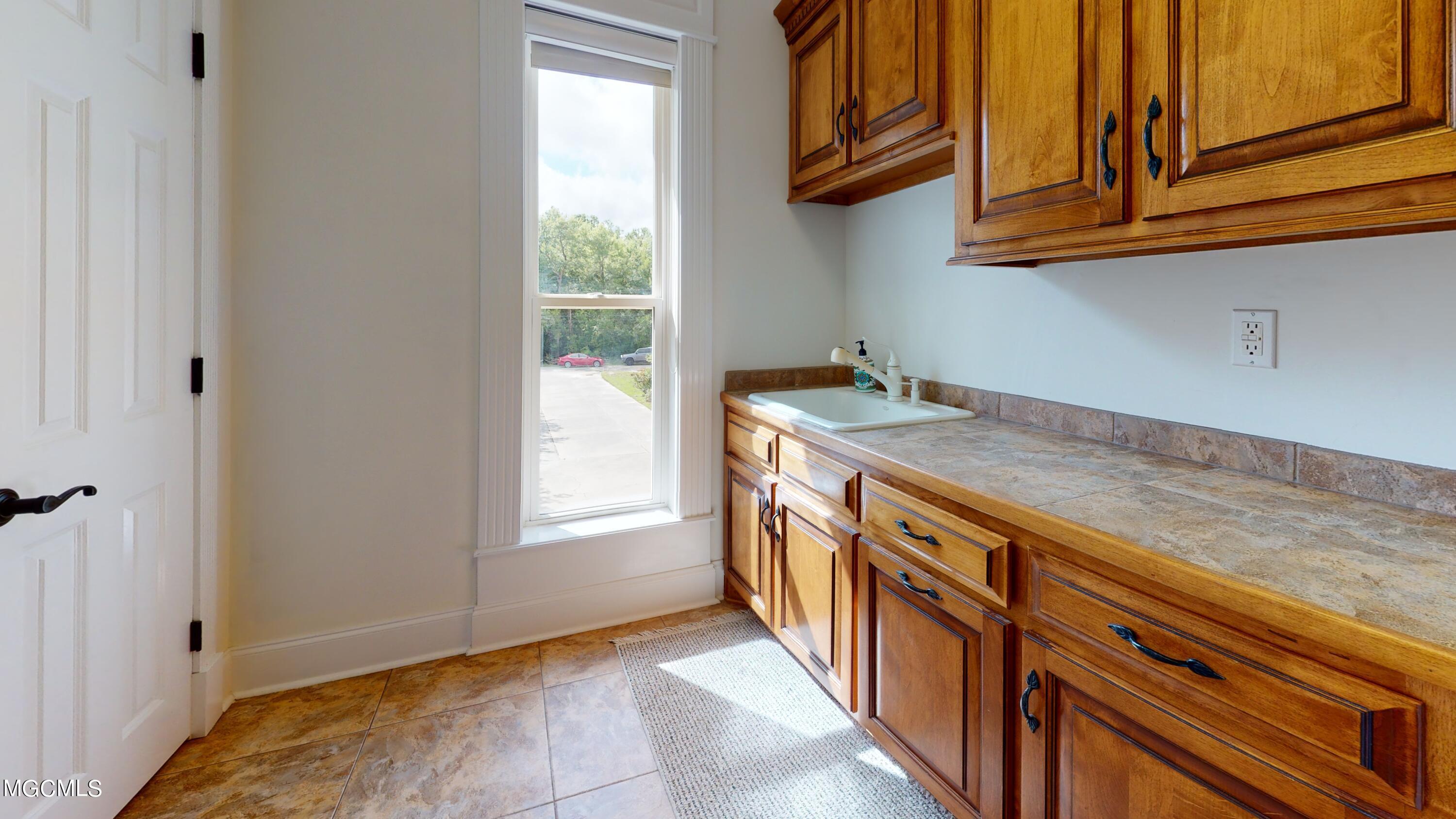 3536 River Bluff Road D'Iberville, MS 39540 - Photo 10 of 20 3536-River-Bluff-Rd-Laundry