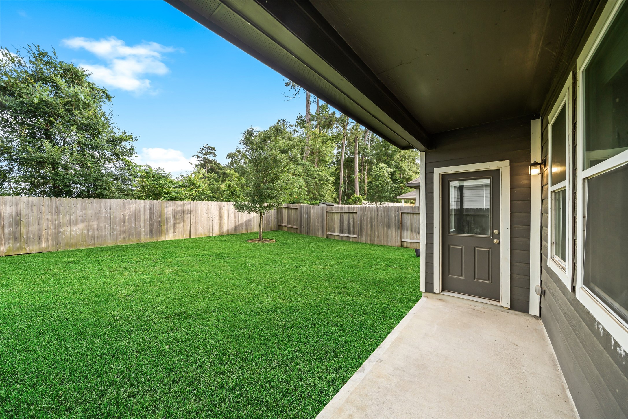 3628 Cub Drive Conroe, TX 77301 - Photo 30 of 32 Covered patio - great for grilling or a small table & chairs setup - such a nice space to enjoy your morning coffee or your evening glass of wine.