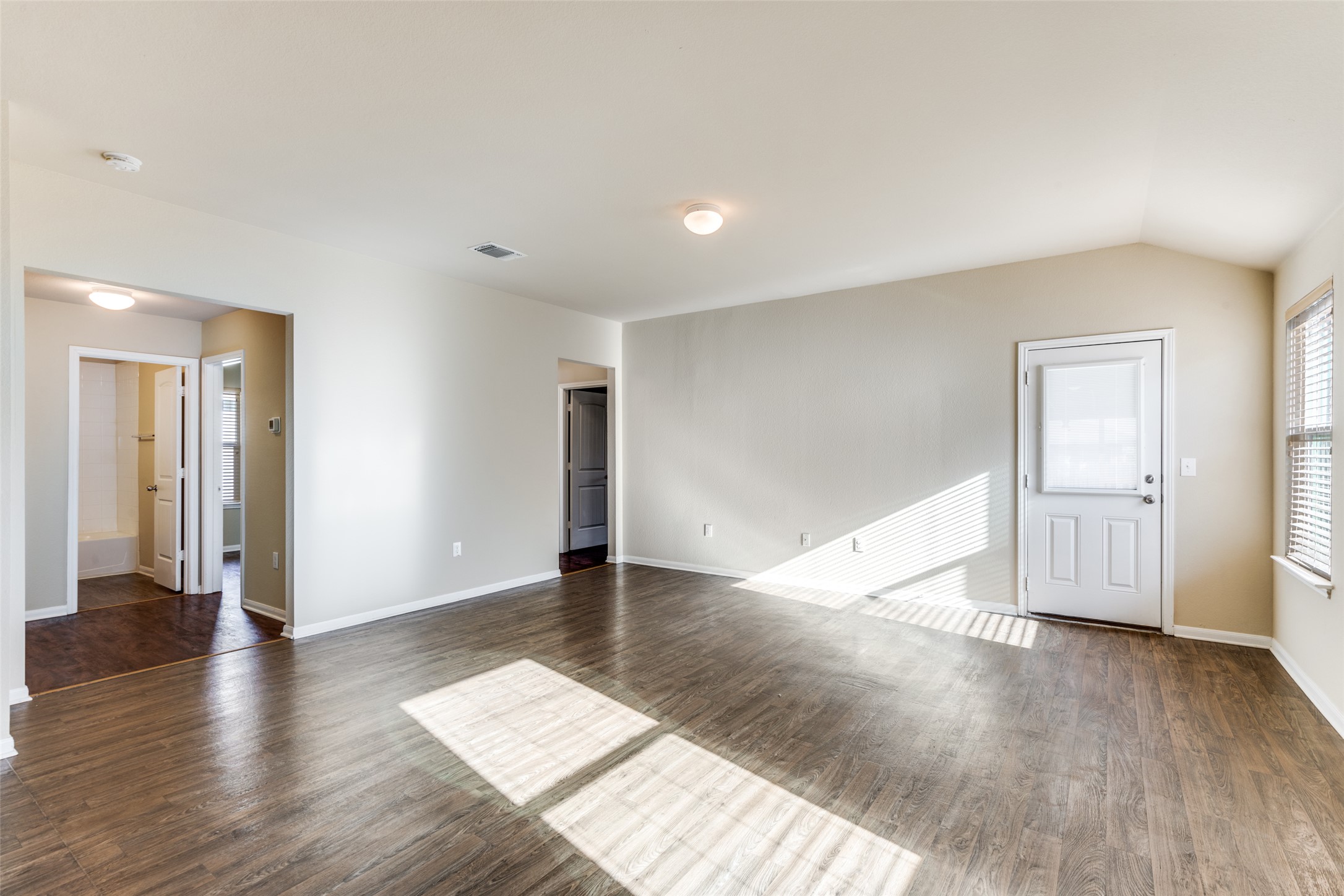 801 Silver Wing Drive Austin, TX 78725 - Photo 7 of 29 a view of an empty room with wooden floor and closet