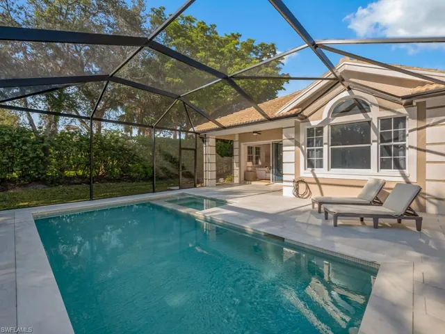 a view of a backyard with sitting area