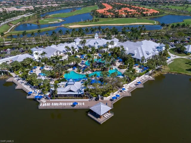 an aerial view of a house with a lake view