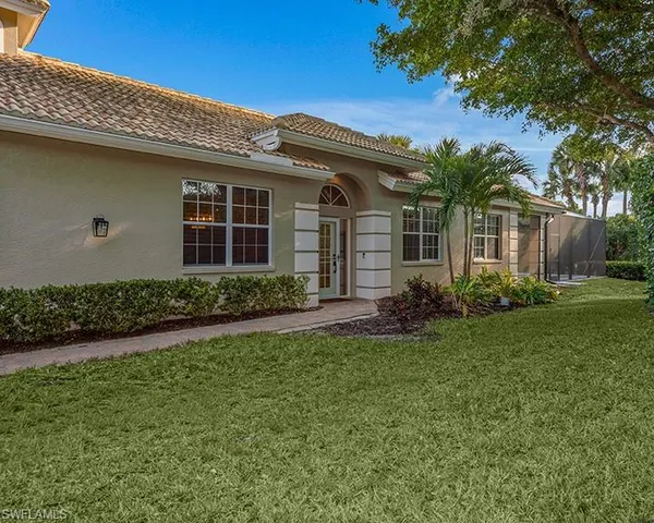 front view of a house with a garden